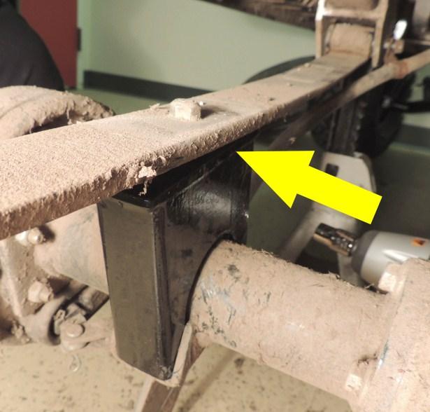 Reattach the front portion of the leaf spring and the brake cable removed in step 4 using the original pivot bolt.