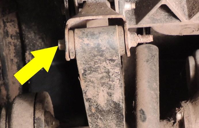 With the axle supported by the jack, remove the (2) nuts holding the driver s side U-bolt around the rear