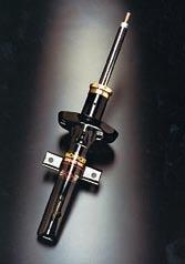 SPEEDPRO SERIES Some dampers, as shown here, form part of a suspension strut. (Courtesy - Tenneco Automotive) Double wishbones with coil over shock absorber seen here on a Caterham 7.