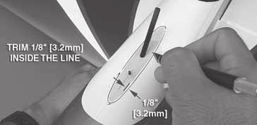 it fore and aft until the fairing is approximately centered. With a felt-tip pen, trace the outline of the fairing on the fuselage. 4.