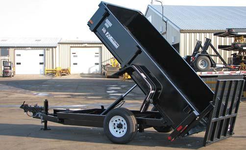 dump box is placed between the wheels allowing a lower profile thereby allowing easier loading