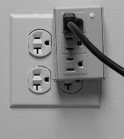 Immediately plug the AC power cord into a grounded AC wall outlet. (A surge protector that protects all three pins on the power plug is recommended.