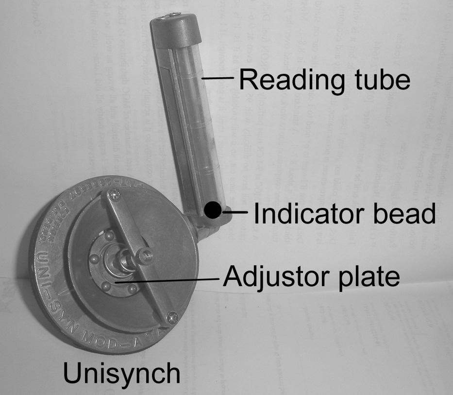 How this device works is that you tightly hold it against the input throat of one of the carbies, adjust the adjustor plate until the indicator bead is about half way up the reading tube.