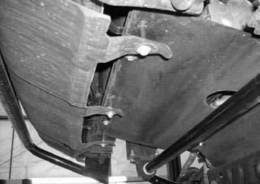 Working on the driver side, remove the stock bracket that is attached to lower portion of the ABS line. The stock bracket may be discarded. Repeat procedure on the passenger 76.