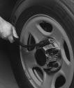 If your vehicle has wheel nut caps, loosen them by turning the wheel wrench counterclockwise.