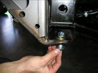Secure lower fixing point by passing through lower bracket in a upward motion, using M2 bolt, 2mm flat washer and secure from the top using large gold coloured