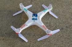 It consisted of attaching waxed kite string to the bottom of the quadcopter with the other end attached to a brick to allow the quad to hover at a 6-foot level above the floor.