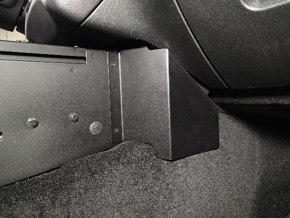 Attach passenger side trim panel to console housing