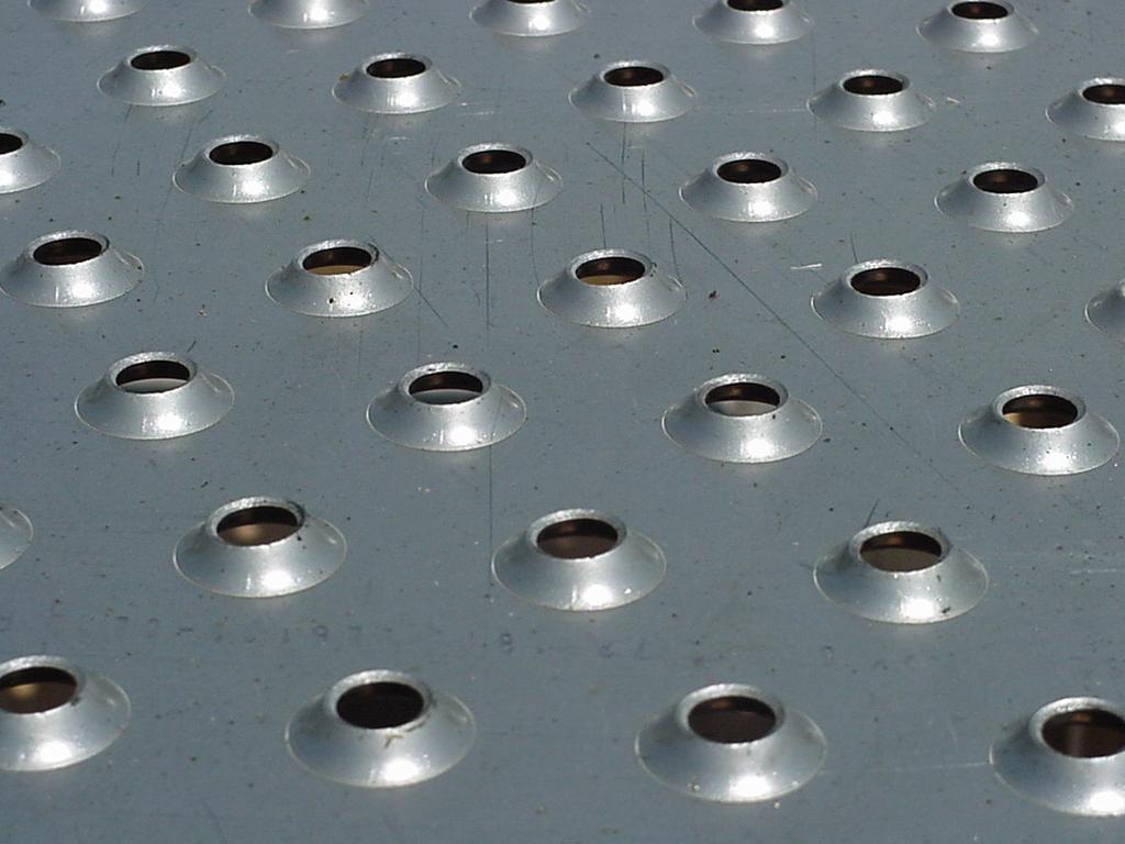 "Modern Sieve Trays for Liquid-Liquid Extraction" Autumn AIChE Meeting Y2013 Photos 11a and 11b Extruded Sieve Holes - 0.375"φ and 0.