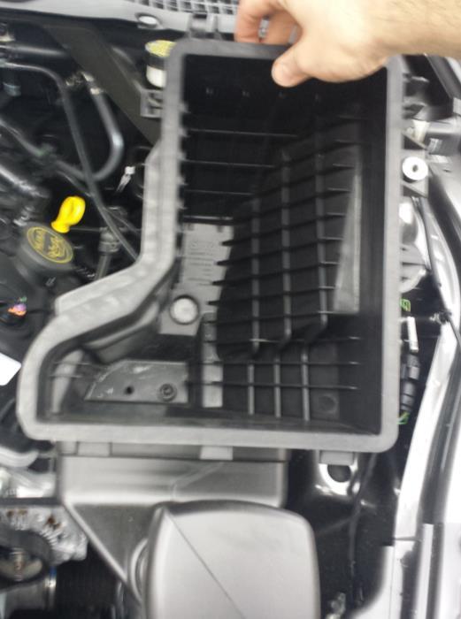 8. Remove the air box tray and dirty air inlet