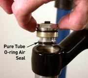 Press down firmly and carefully hand-thread the U-Turn top cap into the upper tube. Using a 24mm socket wrench, tighten to 50 in-lb (fig. 26). 27.