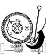 Reengage the transmission by restraining the drum with one hand and turning the shaft clockwise. Reinstall the strap inlet.