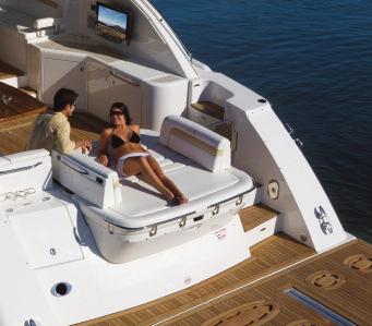 The aft bench has backrest cushions that swing open to extend the already huge sun pad.