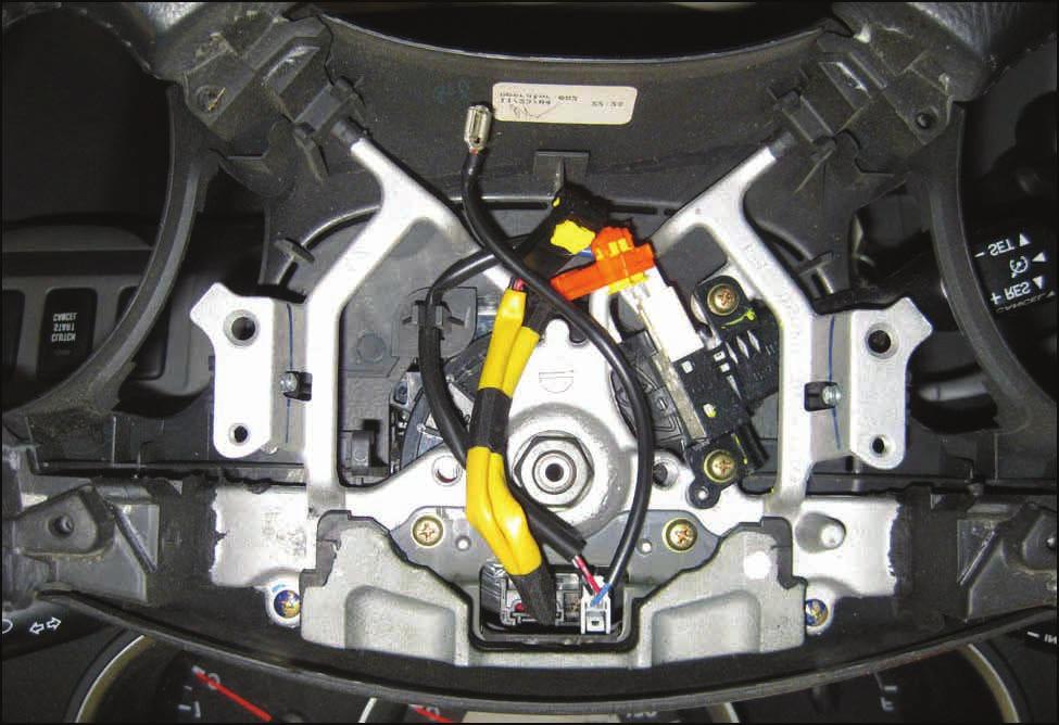 T-SB-0008-14 Rev1 July 28, 2014 Page 10 of 21 C. Install the Steering Wheel Damper with 2 new screws in the location shown in Figures 5 and 6.