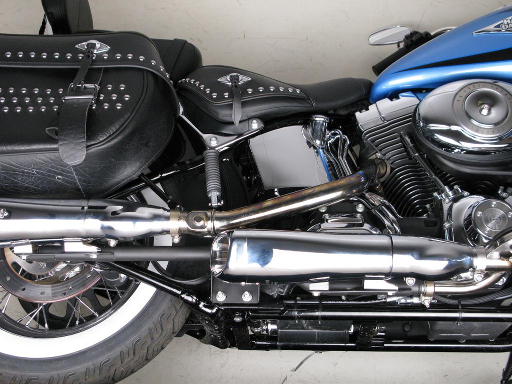 Install the assembled mufflers back onto the motorcycle;