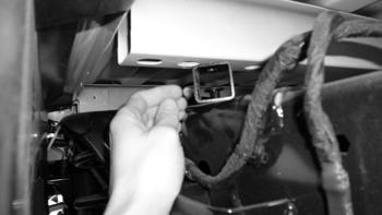 Repeat installation on driver s side. Tighten all body mount bolts to 65 ft-lbs. 18. Locate the spare tire removal tool from under the passenger side seat and lower the spare tire and remove.