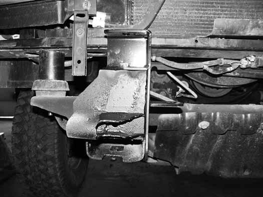 For vehicles equipped with tow hooks, the lower portion of the bumper brackets will be attached when the tow hooks are reinstalled. Figure 27 54.