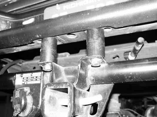 Figure 41 94. Install one of the studs of the provided outside bumper support relocation brackets in the top-rear bumper bracket hole in the frame.