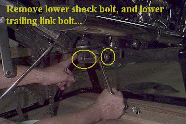 7. Use a 17mm socket on both sides of the upper shock mounting bolt, loosen and remove.