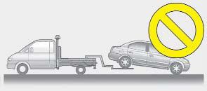 Proper lifting and towing procedures are necessary to prevent damage to the vehicle. The use of wheel dollies or flatbed is recommended.