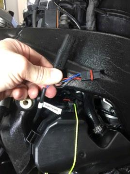 6. Pass the Alpha ignition bypass connectors into this space