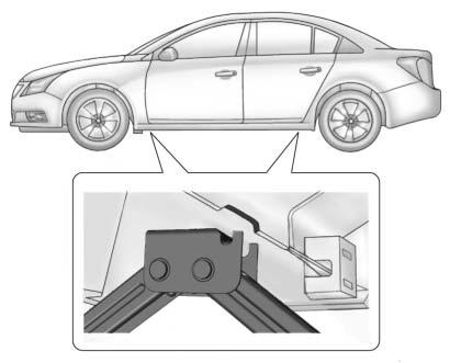 332 Vehicle Care 8. Place the jack under the vehicle. Caution Make sure that the jack lift head is in the correct position or you may damage your vehicle.