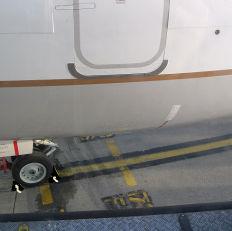 At approximately 5t from the aircraft the Jetway should come to a complete stop so that