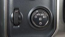 With the vehicle in Park, push down the lever F (B) closer to the instrument panel on the left side of the steering column to move the steering wheel in or out.