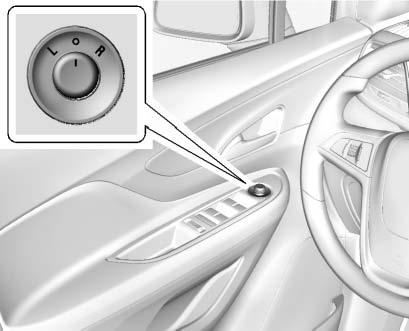 36 Keys, Doors, and Windows Power Mirrors To adjust the mirrors: 1. Turn the selector switch to L (Left) or R (Right) to choose the driver or passenger mirror. 2.