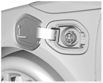 5. Plug in the vehicle plug of the charge cord into the charge port on the vehicle. Verify that the charging status indicator illuminates on top of the instrument panel and an audible beep occurs.