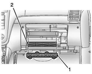 2. Twist the compartment retainers (1) and pull outward to remove. 3. Lower the instrument panel compartment assembly (2) beyond the stops. 4.