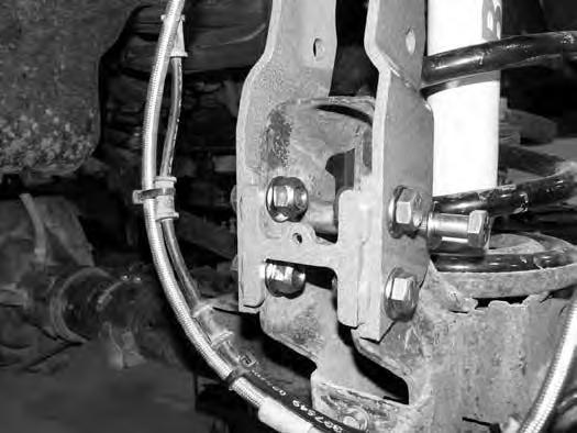 FIGURE 6 25. Install 9/16 x 1-1/2 bolts, nuts and 9/16 SAE washers in the four drilled holes. With all of the hardware installed torque bolts to 95 ft-lbs. 26.