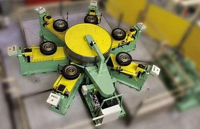 SIX POSITION ENDURANCE TESTER FOR PASSENGER CAR TIRES Horizontally aligned road wheel, designed for tire endurance testing with up to six tires to be tested simultaneously.