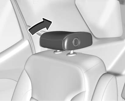 To fold the head restraint, press the button on the side of the head restraint. The head restraint will fold rearward automatically.