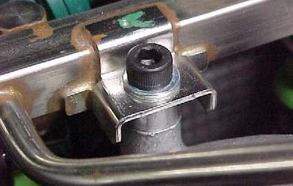Unbolt the four 5mm socket head bolts holding the fuel rail assembly to the intake manifold at Points in Figure 2.