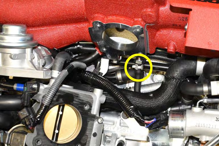 If the throttle body is stuck, gently tap around the sides with a rubber mallet to break
