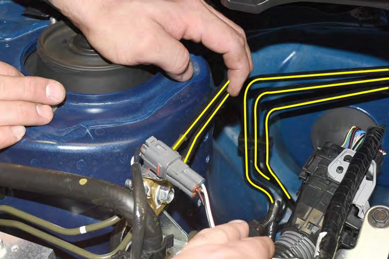 28. Using your hands carefully pry and bend the brake lines