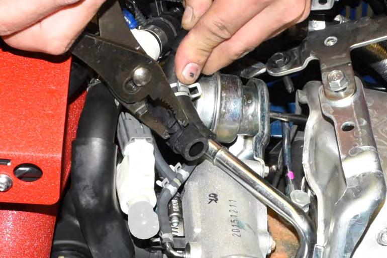 45. Pull the OEM upper coolant line off the turbocharger hard pipe and quickly swap the lower IAG
