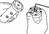 1. Use a 9/64" Allen wrench to remove the top cap screws. (Fig.15) Figure 15 2. Separate the top cap and data plate from the upper body section. (Fig.15) 3.