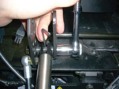 Use a 9/16 socket and ratchet to remove the bolts that attach the bottom of the recline actuator. 7.