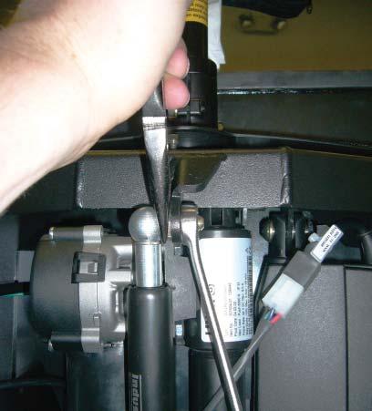 Once one bolt is removed, the same technique may be used to remove the other side of the lower recline actuator mount. 9.