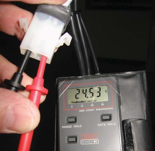 SEATING SECTION 7. 8. 9. Disconnect the 2-pin connector and measure for battery voltage on the cable leading to the base.