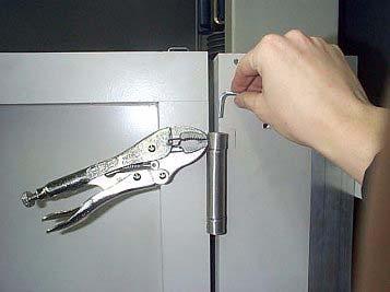 Increase the tension of the spring hinge by turning the Allen key.