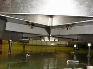 Example of poor installation where underside of base shows bolts only free standing on the floor. 4.