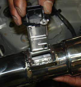 A 10mm socket is used to fasten the horn bracket in its original