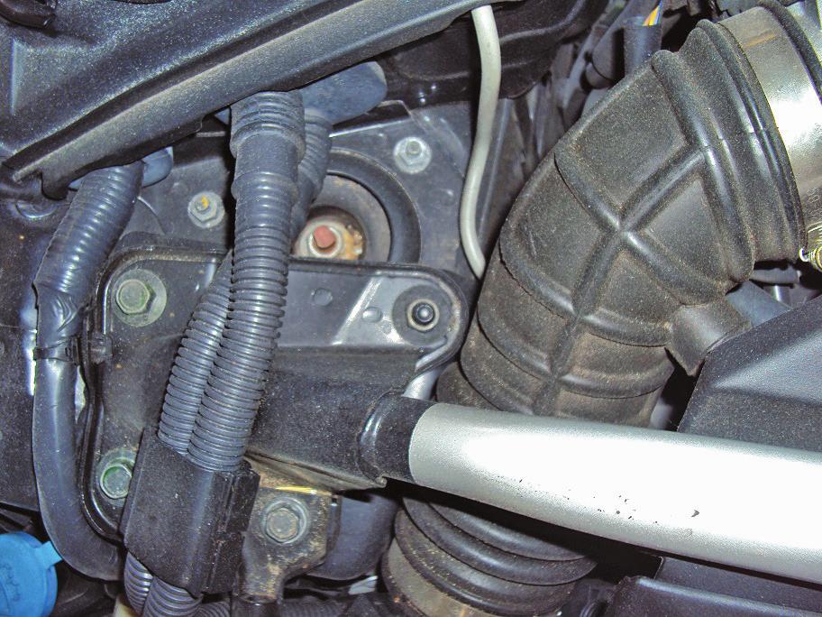 The shock should be installed so that the air spring air port is directed towards the engine compartment.