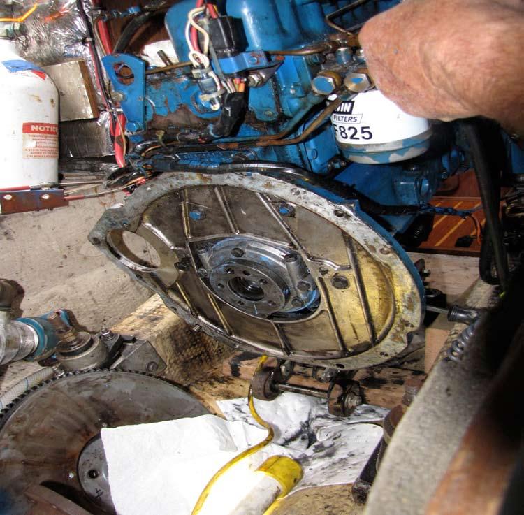 Remove flywheel, exposing engine shaft coupler.