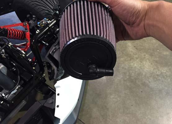 3 Install the air filter onto the inlet of the supercharger and secure with the supplied hose