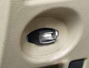 To lock the vehicle, push either door handle request switch 01 or the liftgate request switch 02 or press the button 03 on the keyfob.