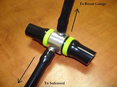 From the appropriate nipple on the vacuum block (largest port), run a length of vacuum tubing along the top of the motor, around the passenger side, down to the remaining linear port on the solenoid